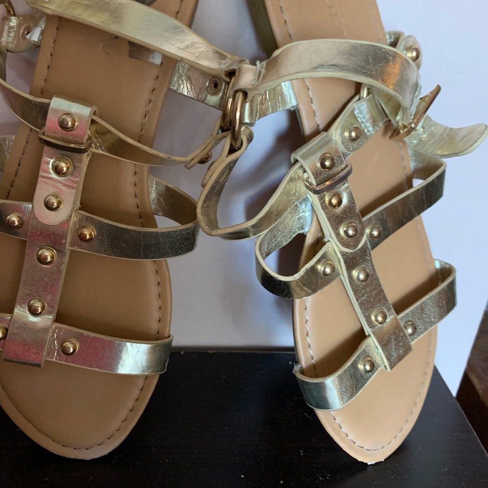 Gladiator style gold sandal. Le chateau